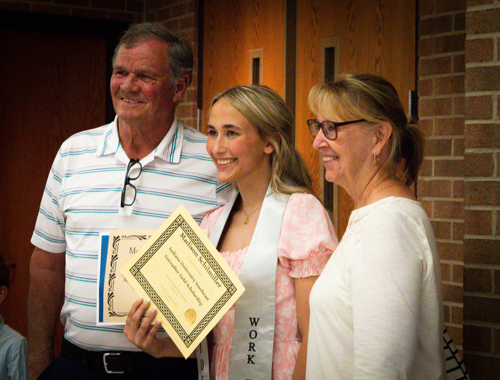 A family of three standing together
