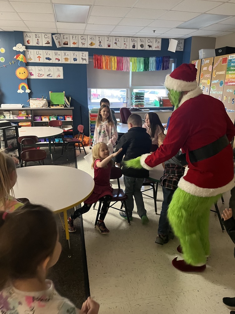The Grinch visits students