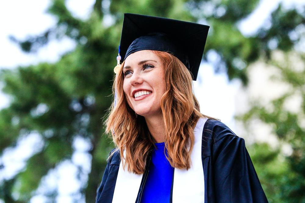 girl with graduation cap and gown on