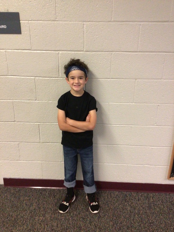 a student displays his crazy hair on crazy hair dress-up day