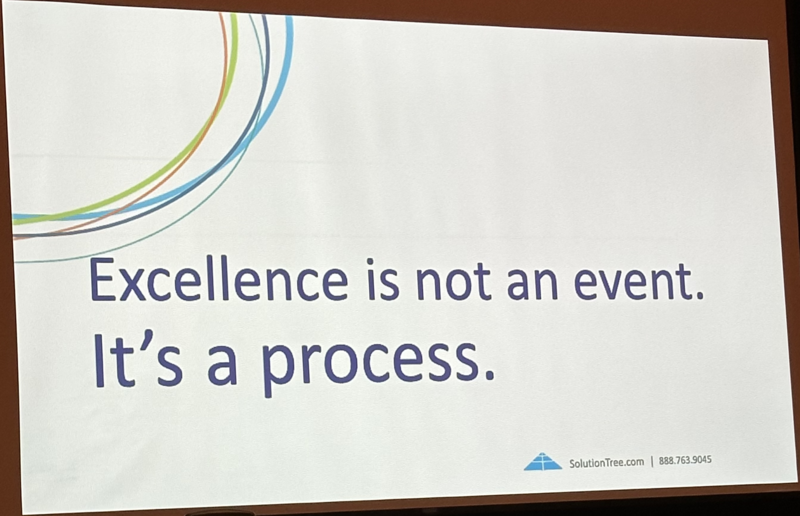 Presentation slide with words, "Excellence is not an event. It's a process."
